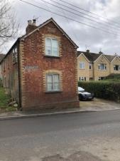 Historic Road Sign for Woodmancote